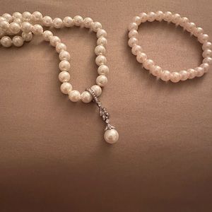 Brand NEW 4-piece Pearl set including 2 necklaces, 1 earring set and 1 bracelet